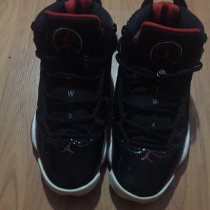 Black red and white Jordan’s